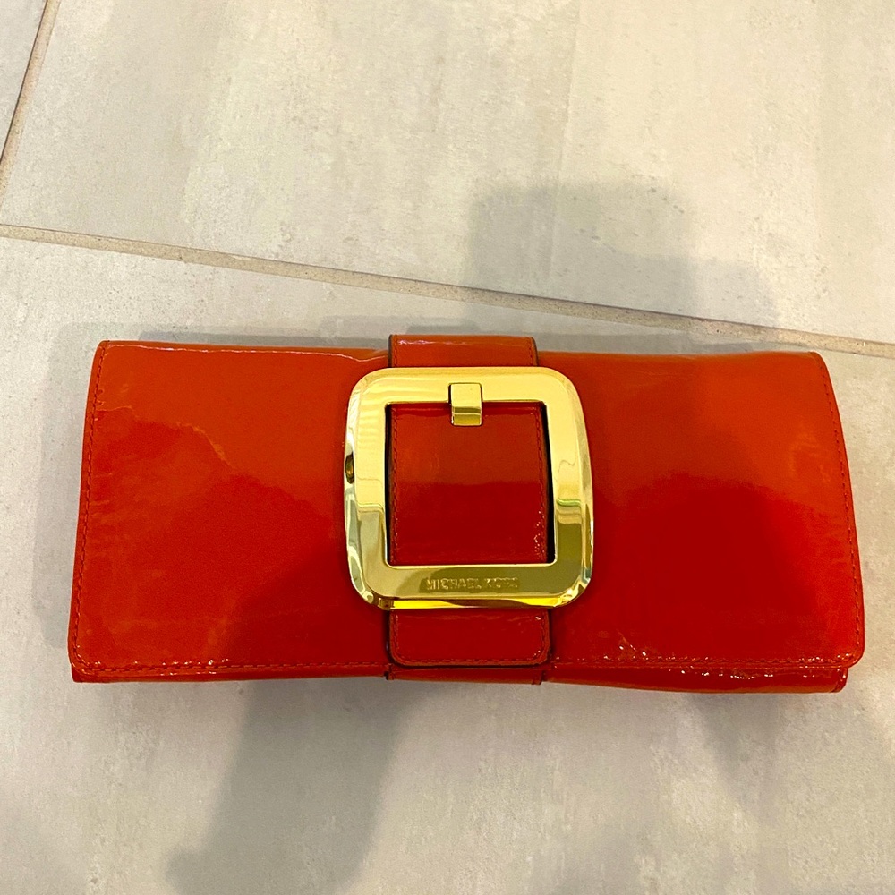 Orange color Michael Kors clutch, beautiful elegant, good condition